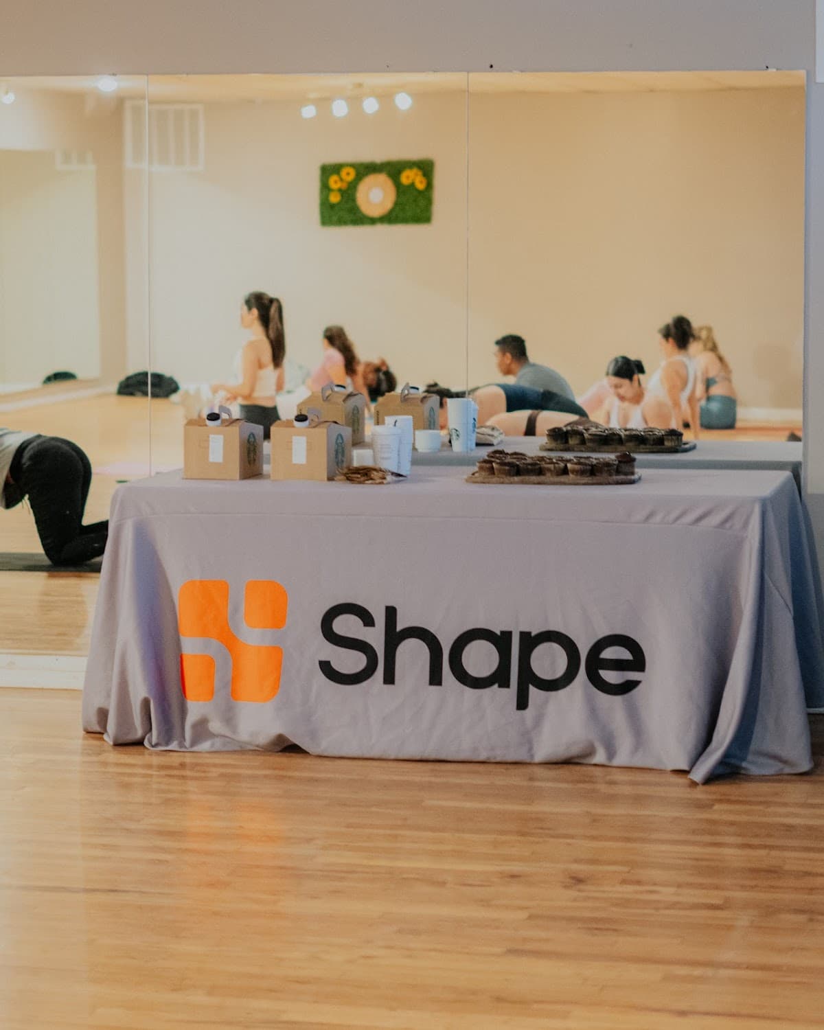 A Shape Health community table at an event